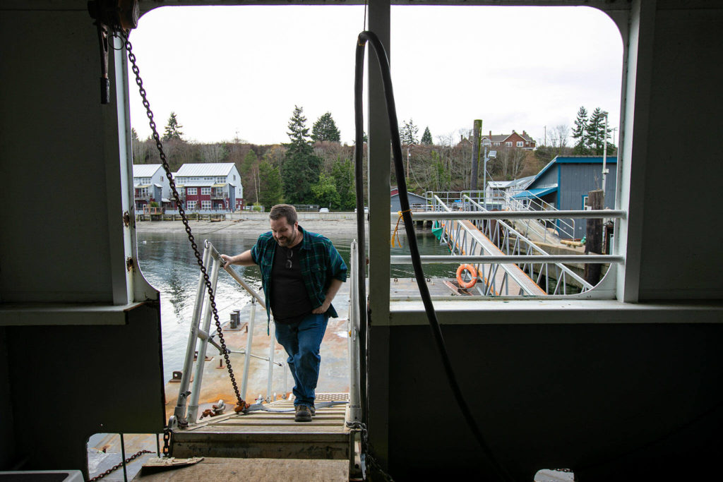 Bart Lematta boards his ferry, the Evergreen State. (Ryan Berry / The Herald)
