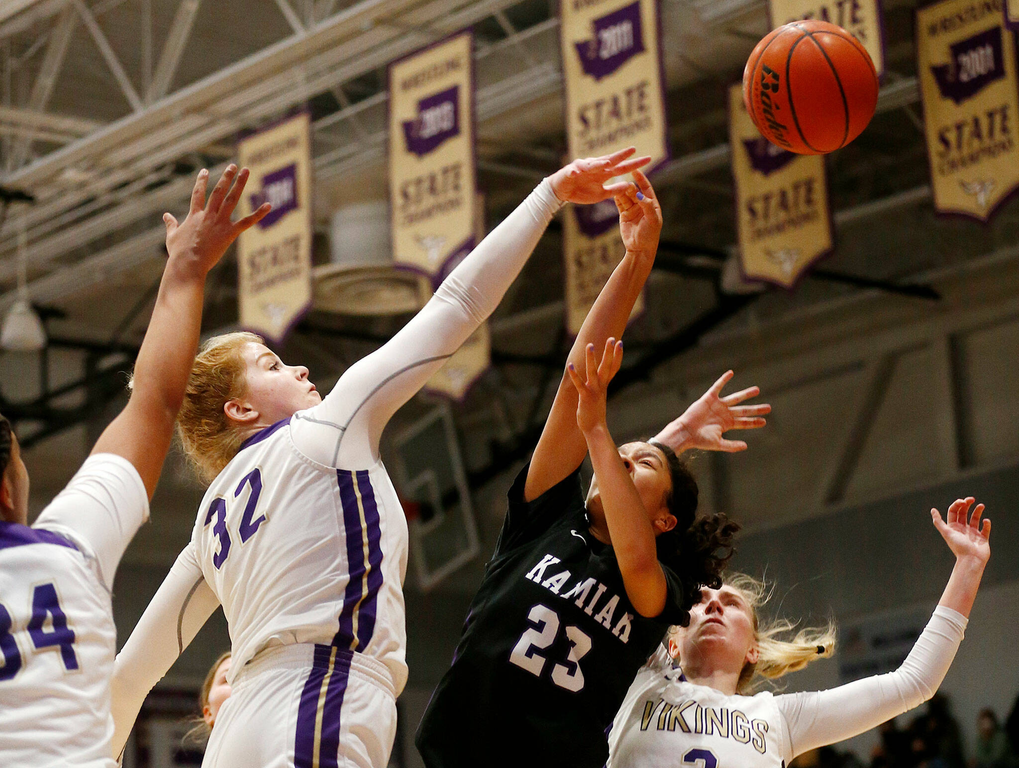 Lake Stevens’ Cori Wilcox records a block down low against Kamiak Monday, Feb. 7, 2022, at Lake Stevens High School in Lake Stevens, Washington. (Ryan Berry / The Herald)