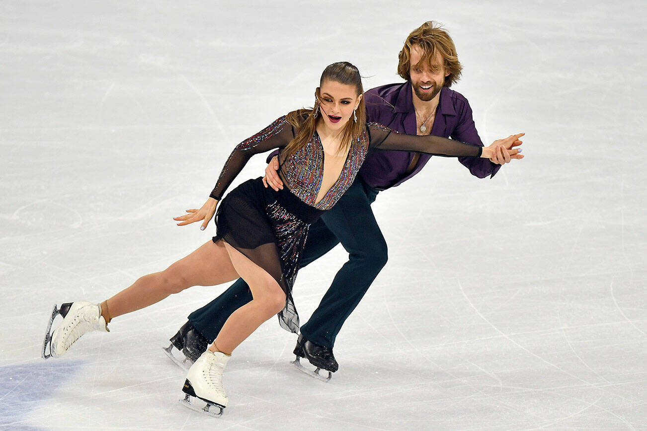 Kaitlin Hawayek and Jean-Luc Baker of the USA perform during the Ice Dance - Rhythm Dance at the Figure Skating World Championships in Stockholm, Sweden, Friday, March 26, 2021. (AP Photo/Martin Meissner)