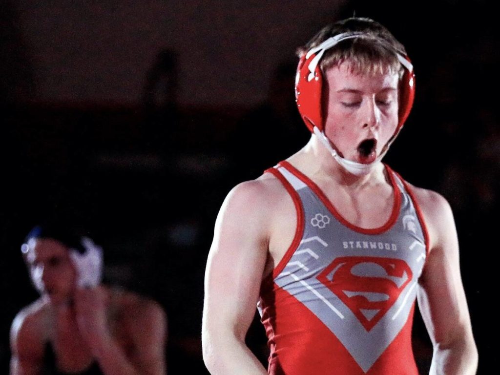 Stanwood junior Tyler Rhue celebrates his victory during a dual meet last month. (Kevin Clark / The Herald)
