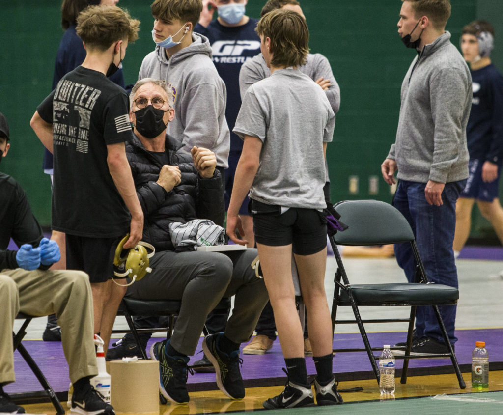 Lake Stevens head wrestling coach Brent Barnes talks with some of his wrestlers before the start of the championship matches at the Wesco 4A sub-regional tournament at Henry M. Jackson High School on Feb. 5 in Everett. (Olivia Vanni / The Herald)
