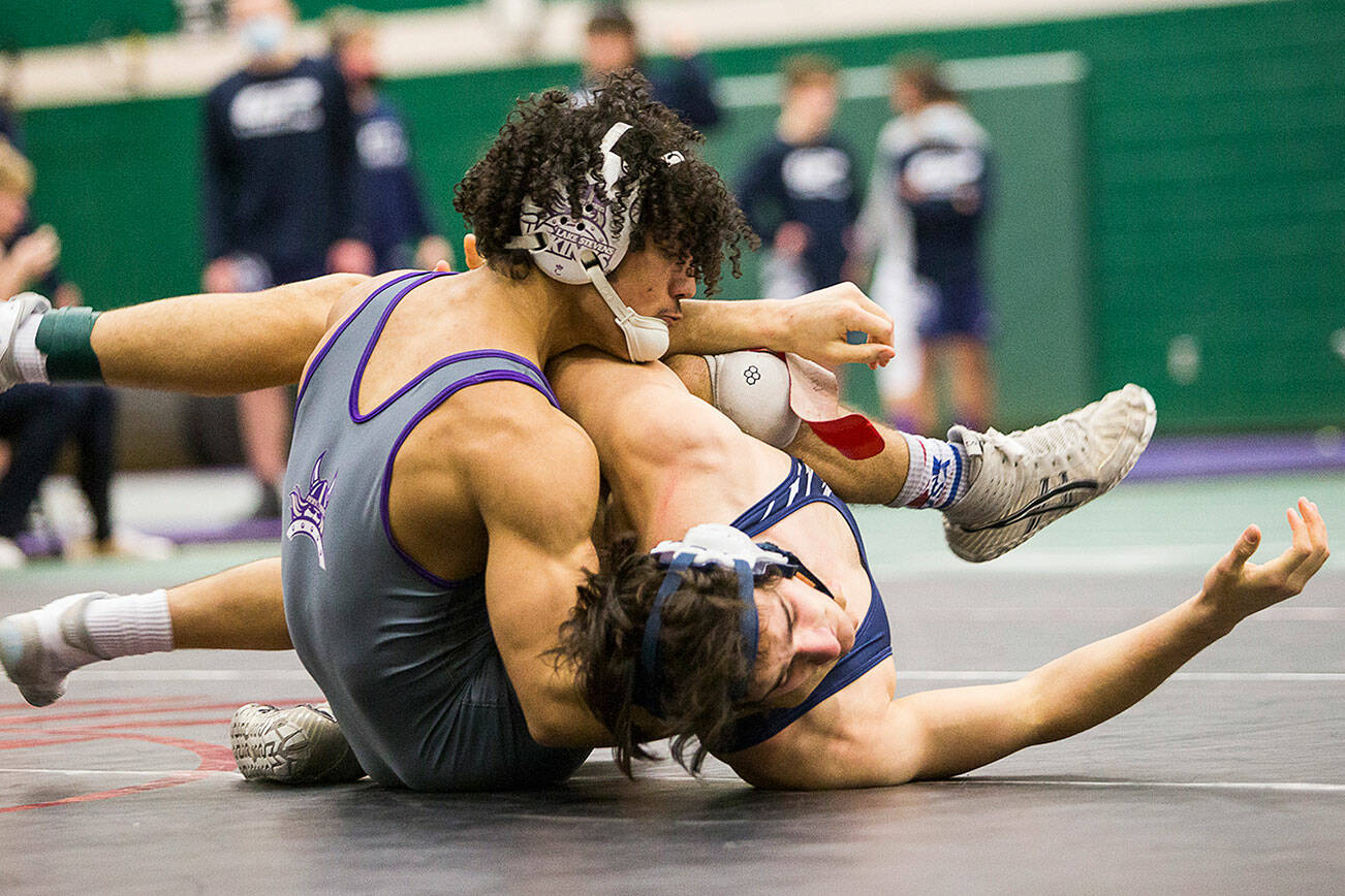 Lake Stevens’ Jackson Balmer attempts to flip Glacier Peak’s Spencer Dhondt to his back during their match at the 4A sub-regional wrestling meet at Henry M. Jackson High School on Saturday, Feb. 5, 2022 in Everett, Wa. (Olivia Vanni / The Herald)