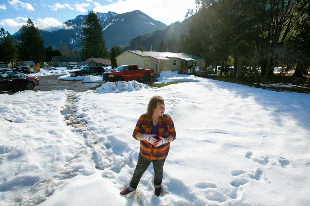 Diane Altman Jennings stands outside her father’s old home, the Dinsmore Hiker Haven, along the Pacific Crest Trail in Baring. (Ryan Berry / The Herald) 
