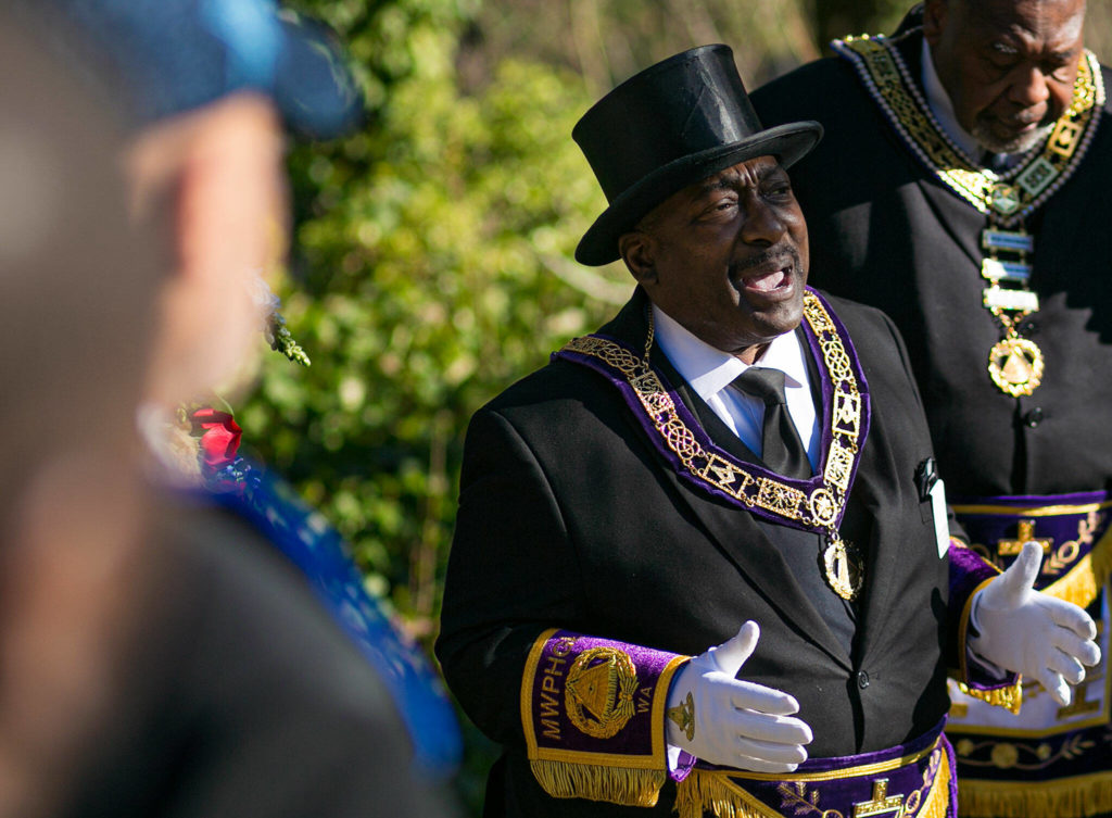 Gilbert E. McClary, Sr., Most Worshipful Grand Master of the Prince Hall Grand Lodge of Washington, speaks about the life of Ben Lewis during a ceremony Friday at Evergreen Cemetery in Everett. (Ryan Berry / The Herald)
