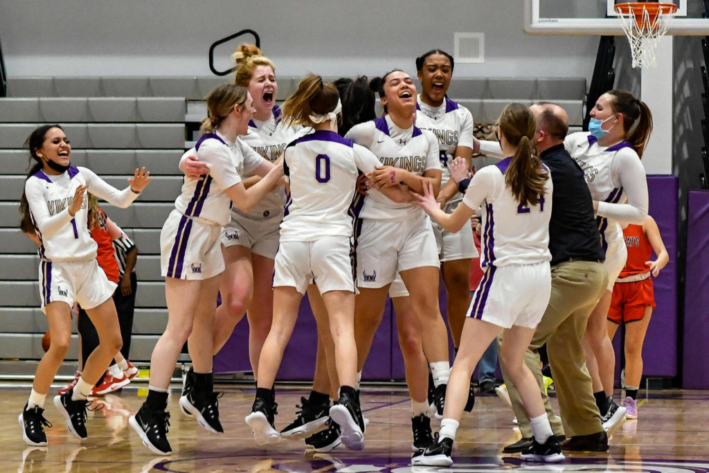 The Lake Stevens girls basketball team celebrates after beating Mount Si 58-57 in overtime of a 4A District 1/2 Tournament game on Friday, Feb. 11, 2022, at Lake Stevens High School. (John Gardner / Pro Action Image)
