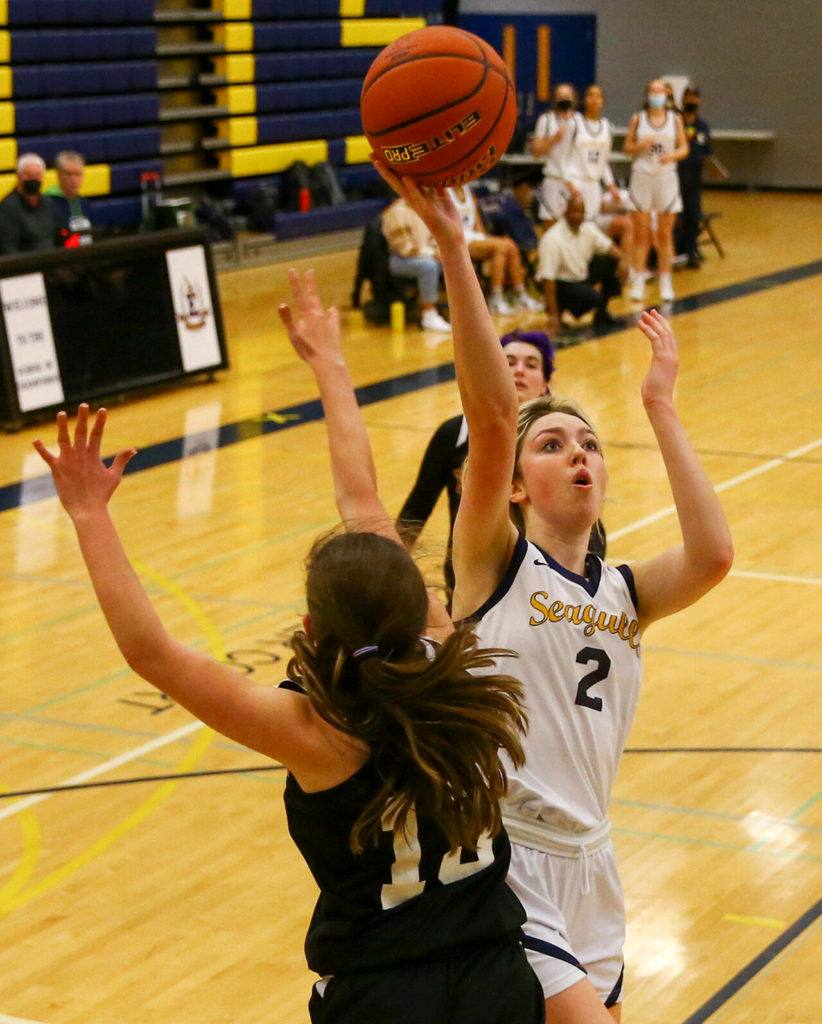 Everett’s Emma Larson attempts a shot against Mountlake Terrace Friday evening in Everett, Washington on February 11, 2022. (Kevin Clark / The Herald)
