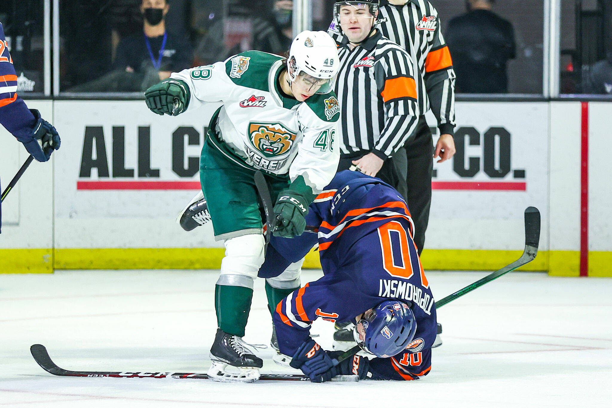 The Silvertips’ Olen Zellweger (48) takes down the Blazers’ Luke Toporowski during a game on Saturday, Feb. 12, 2022, at Angel of the Winds Arena in Everett. (Kristin Ostrowski / Everett Silvertips)