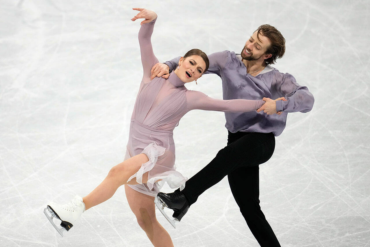 Kaitlin Hawayek and Jean-Luc Baker, of the United States, perform their routine in the ice dance competition during the 2022 Winter Olympics on Monday in Beijing. (AP Photo/Natacha Pisarenko)