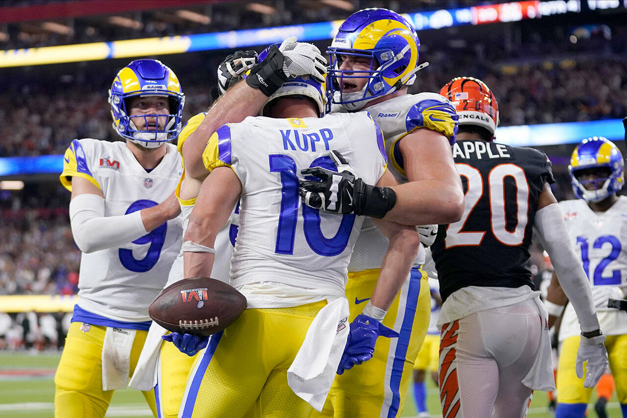 Los Angeles Rams wide receiver Cooper Kupp (10) is congratulated by teammates after scoring a touchdown against the Cincinnati Bengals during the second half of Super Bowl 56 on Sunday in Inglewood, Calif. (AP Photo/Marcio Jose Sanchez)
