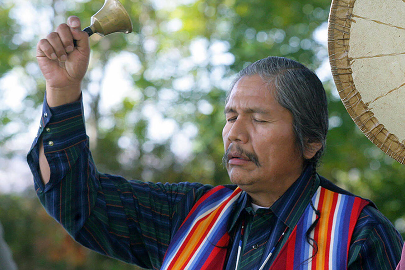 Rex Buck of the Wanapum tribe., left, rings a bell during a blessing ceremony to prepare Sacajawea State Park near Pasco, Wash., for its future art installations on Friday, Oct. 27, 2006. The park will be one of seven sites which will be getting art installations as part of the Confluence Project. The project will commemorate locations along the Columbia River Basin where waterways merge or American Indians traditionally gathered. (AP Photo/Jackie Johnston)