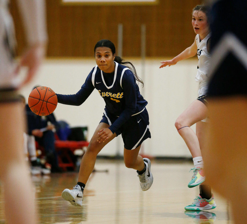 Everett’s Mylie Wugumgeg takes the ball up the court against Arlington Tuesday, Feb. 15, 2022, at Marysville Pilchuck High School in Marysville, Washington. (Ryan Berry / The Herald)
