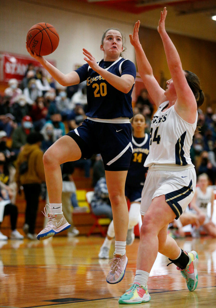 Everett’s Ella Sylvester hits a difficult hook shot against Arlington Tuesday, Feb. 15, 2022, at Marysville Pilchuck High School in Marysville, Washington. (Ryan Berry / The Herald)
