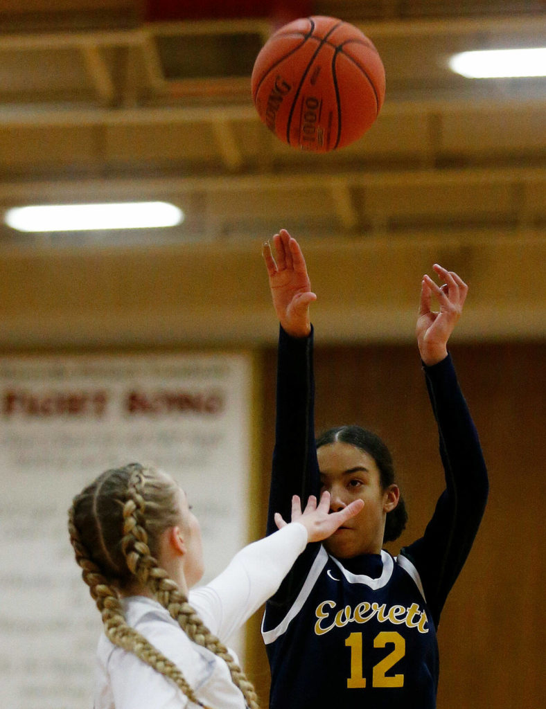 Everett’s Alana Washington hits a deep three against Arlington Tuesday, Feb. 15, 2022, at Marysville Pilchuck High School in Marysville, Washington. (Ryan Berry / The Herald)
