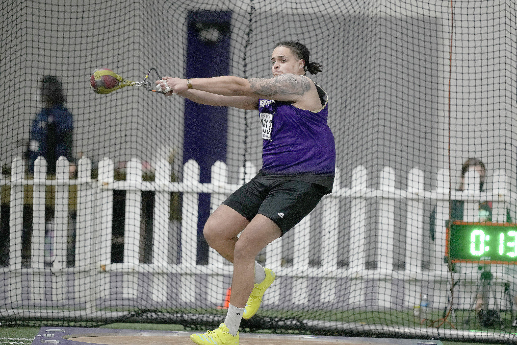 Washington’s Jayden White, an Everett High School alum, broke his own school record in the weight throw at the Husky Classic on Feb. 12, 2022, in Seattle. (Red Box Pictures)