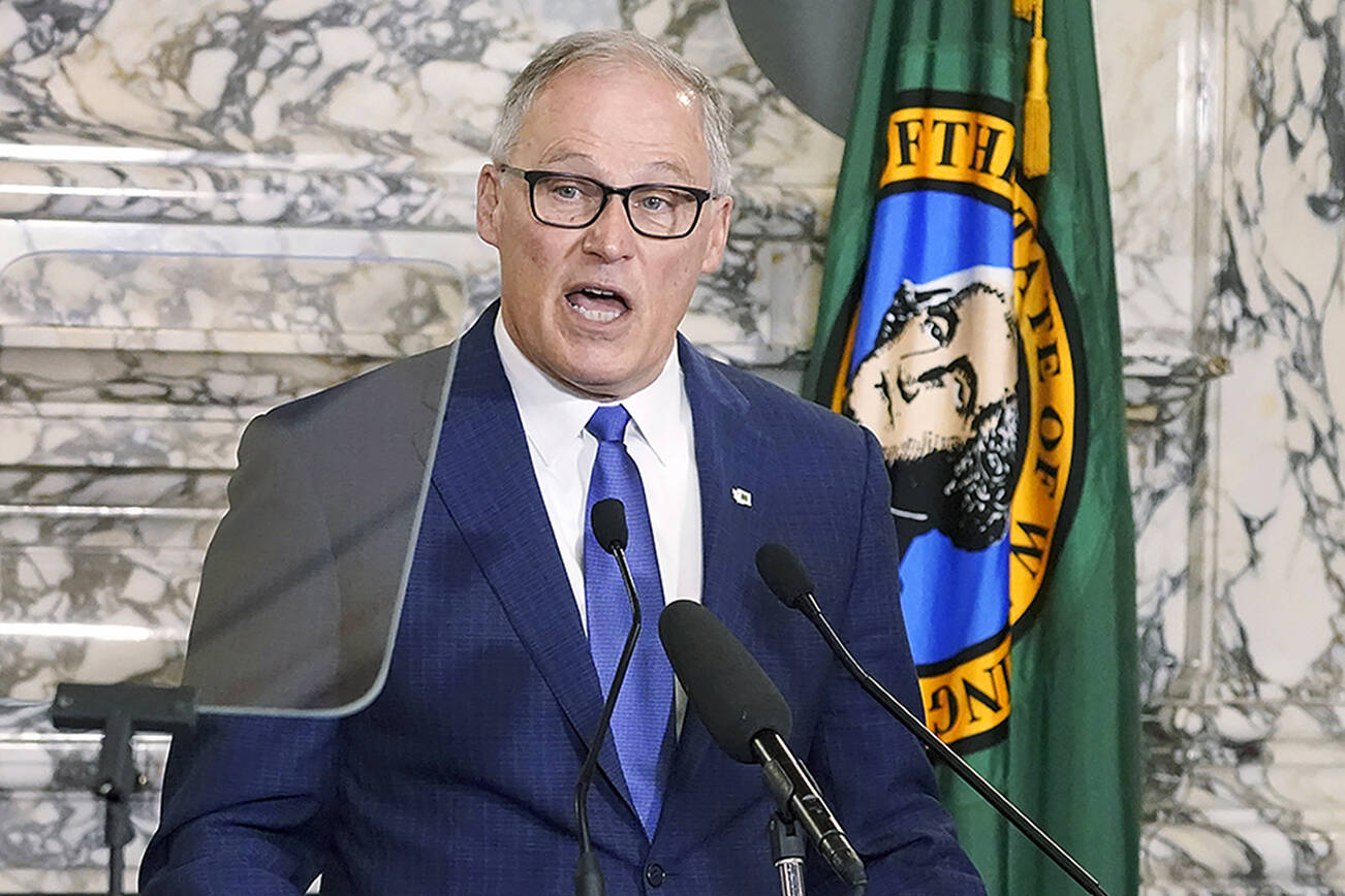 FILE - Washington Gov. Jay Inslee speaks as he gives his annual State of the State address on Jan. 11, 2022, at the Capitol in Olympia, Wash. On Tuesday, Feb. 15, 2022, Sen. David Frockt, D-Seattle, said that a bill sought by Inslee that would make it a crime for elected officials or candidates to knowingly lie about election outcomes if those claims result in violence would not be brought up for a vote on the Senate floor because the bill did not have enough support to clear the Democratic-led chamber. (AP Photo/Ted S. Warren, File)