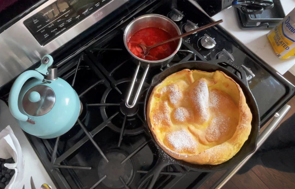 Herald food reporter Taylor Goebel made this Dutch baby in her home kitchen Feb. 21. She sprinkled it with powdered sugar and topped it with strawberry compote. (Video screenshot / The Herald)
