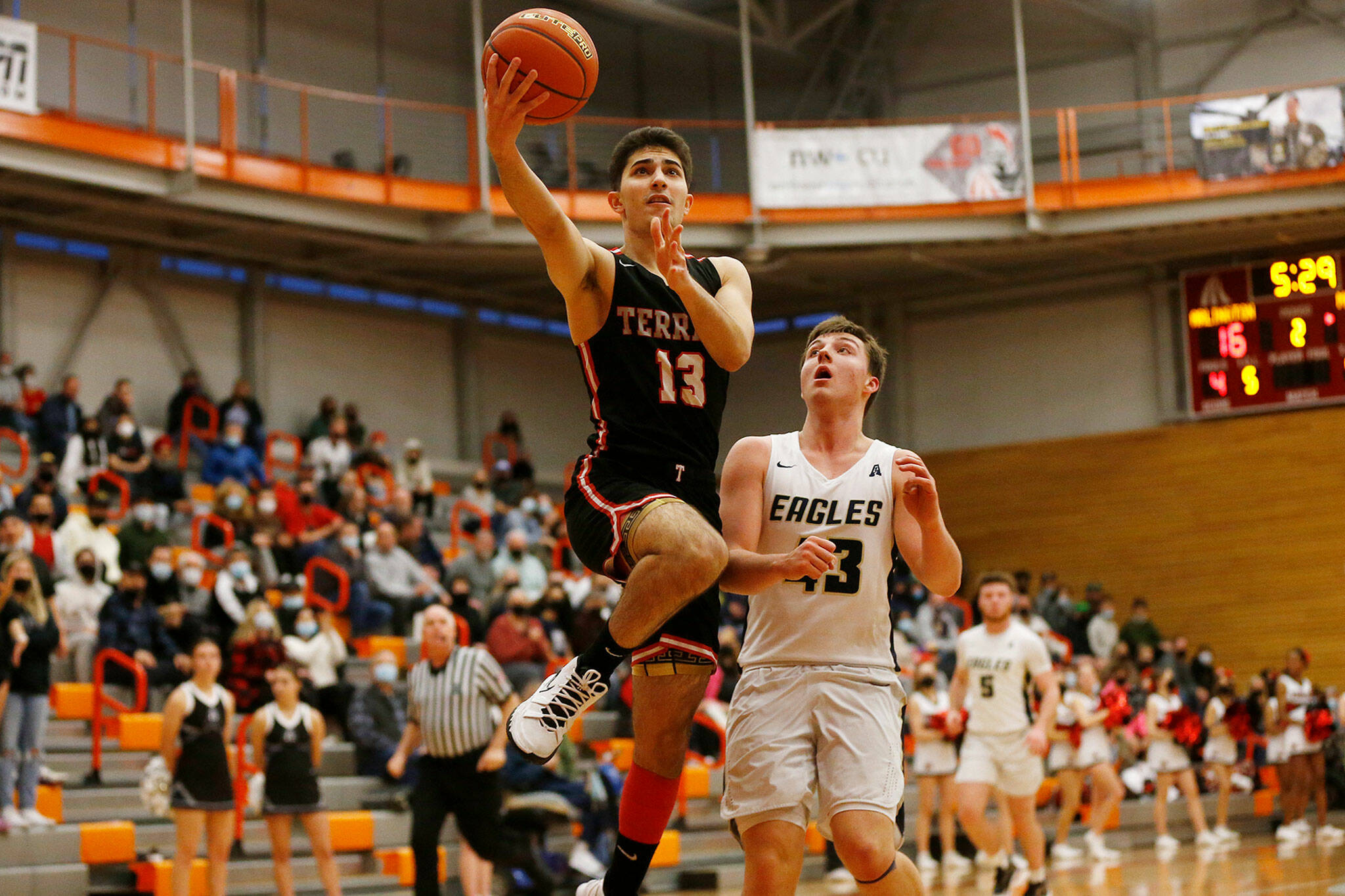 Tigran Mkrtychan finishes a fast break during Mountlake Terrace’s 51-46 win over Arlington in the Class 3A District 1 Tournament semifinals Wednesday night. The Hawks clinched a state berth with the victory. (Ryan Berry / The Herald)