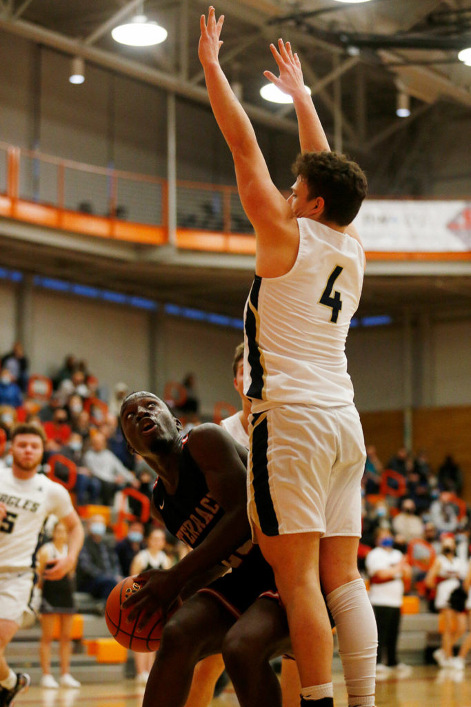 Mountlake Terrace’s Jeffrey Anyimah gets his defender in the air before scoring against Arlington during a 3A District 1 Tournament semifinal game on Wednesday at Everett Community College. (Ryan Berry / The Herald)
