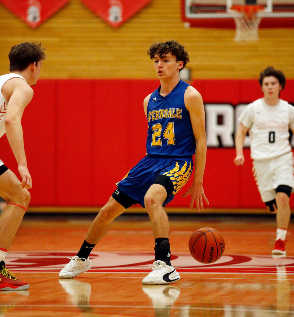 Ferndale’s Luke Wells crosses up an opponent against Stanwood during a 3A District 1 Tournament semifinal game on Wednesday at Everett Community College. (Ryan Berry / The Herald)
