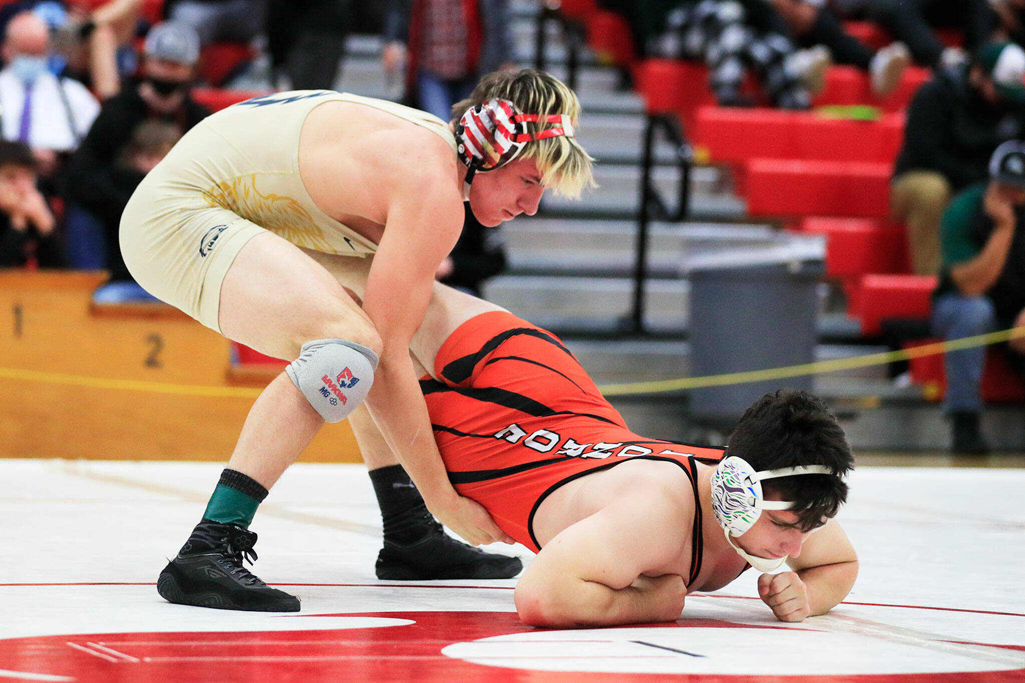 Arlington’s Trevor Latta wrestles Monroe’s Brian Zebley Jr. Saturday evening during the 3A Regional 1 boys wrestling tournament at Snohomish High School in Snohomish, Washington on February 12, 2022. (Kevin Clark / The Herald)