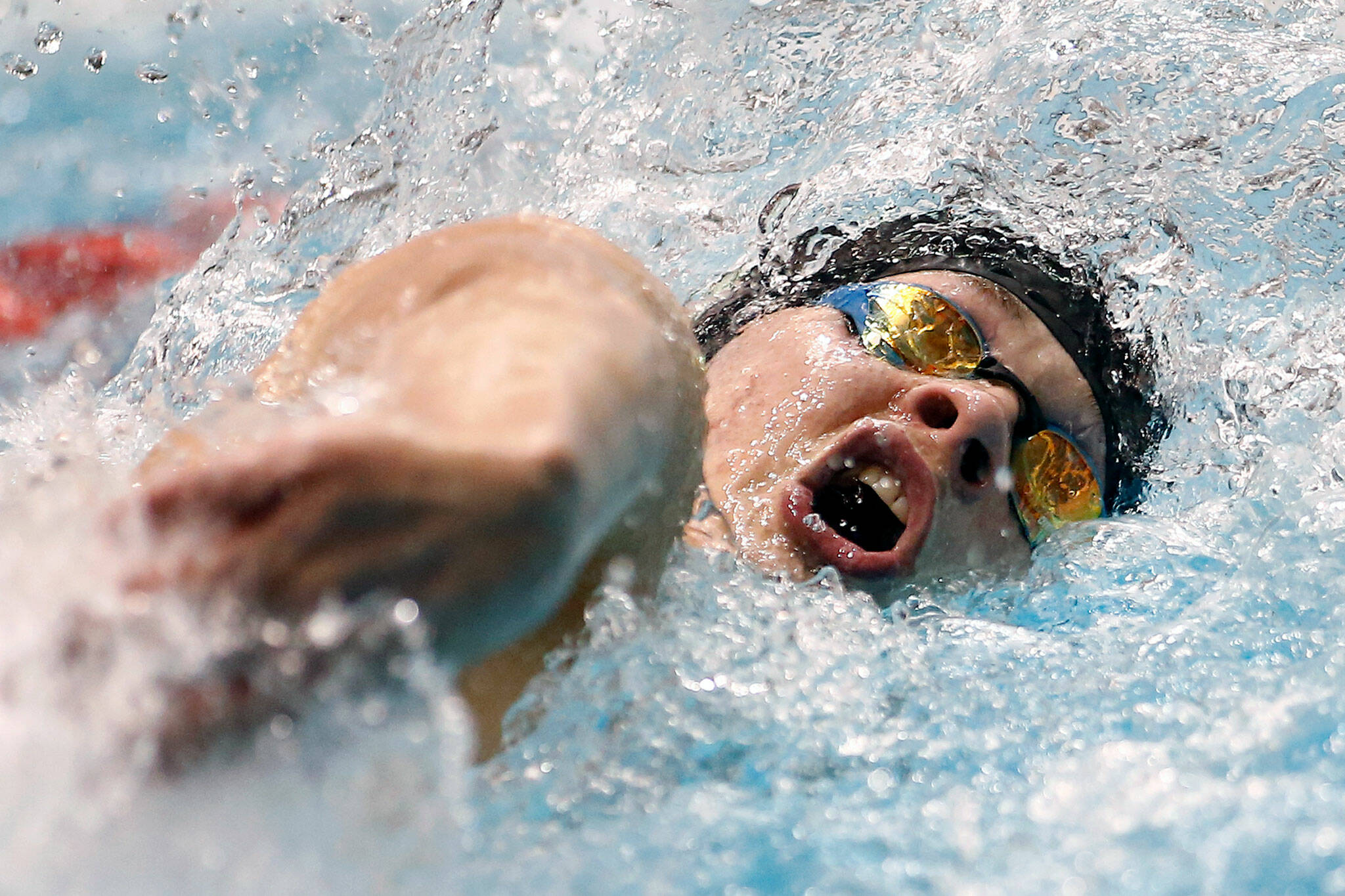 Jensen Elsemore, of Jackson, competes in the 100 yard freestyle during the WIAA 4A Boys Swimming Championship on Saturday at the King County Aquatic Center in Federal Way. (Ryan Berry / The Herald)
