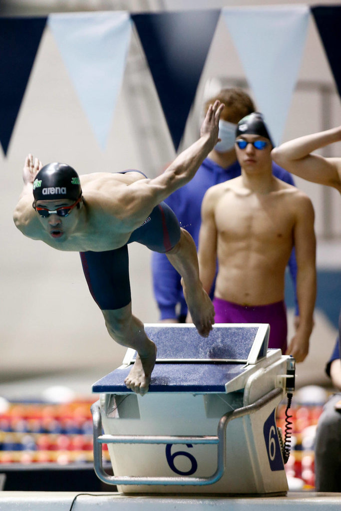 Ethan Chen-Parks, of Jackson High, dives in to begin the 200 yard freestyle relay during the WIAA 4A Boys Swimming Championship on Saturday at the King County Aquatic Center in Federal Way. (Ryan Berry / The Herald)