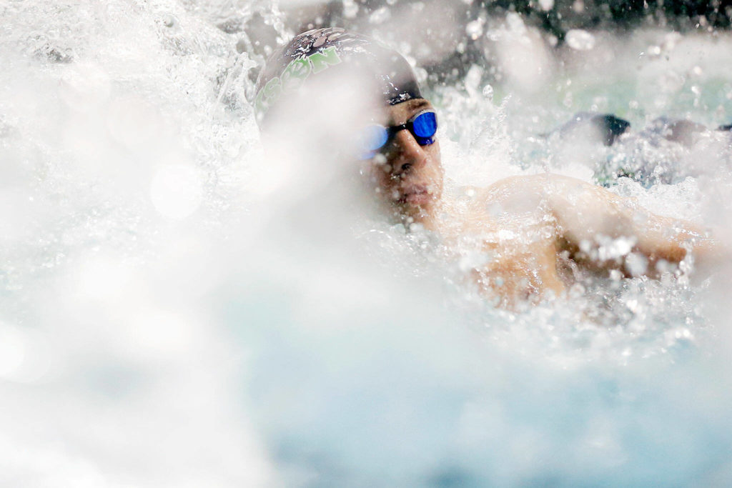 Jackson’s Ethan Georgiev turns to check his team’s time after finishing the 200 yard medley relay during the WIAA 4A Boys Swimming Championship on Saturday at the King County Aquatic Center in Federal Way. (Ryan Berry / The Herald)