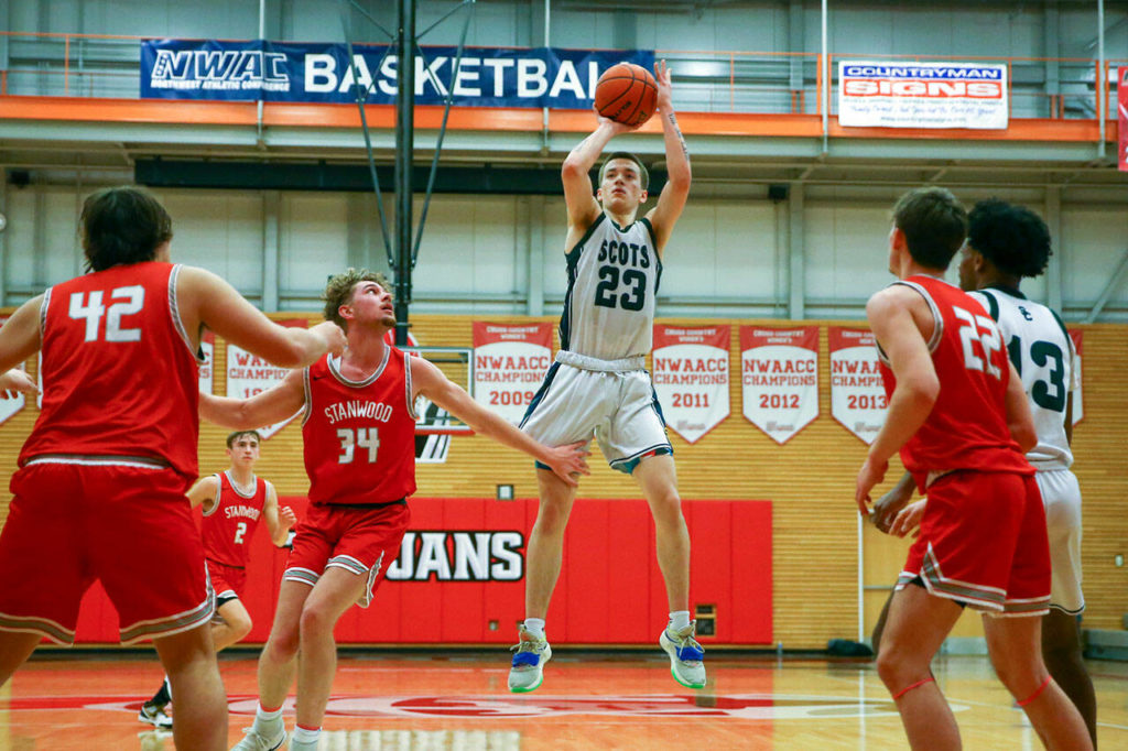 Shorecrest’s Parker Baumann pulls up for a jumper Saturday afternoon at during the 3A District Tournament at Everett Community College in Everett, Washington on February 19, 2022. (Kevin Clark / The Herald )
