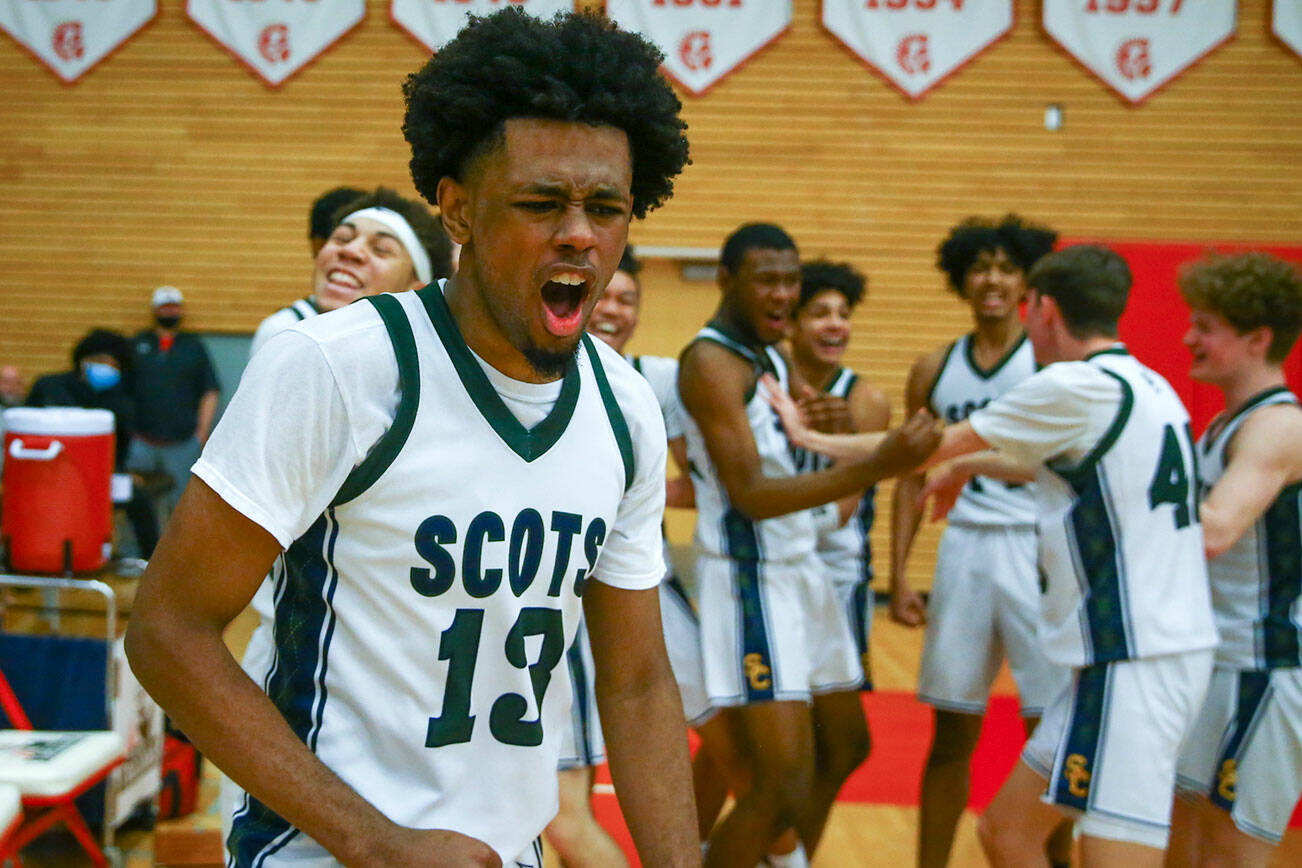 Shorecrest’s Newton Pepple celebrates their win over Stanwood Saturday afternoon at during the 3A District Tournament at Everett Community College in Everett, Washington on February 19, 2022. (Kevin Clark / The Herald )