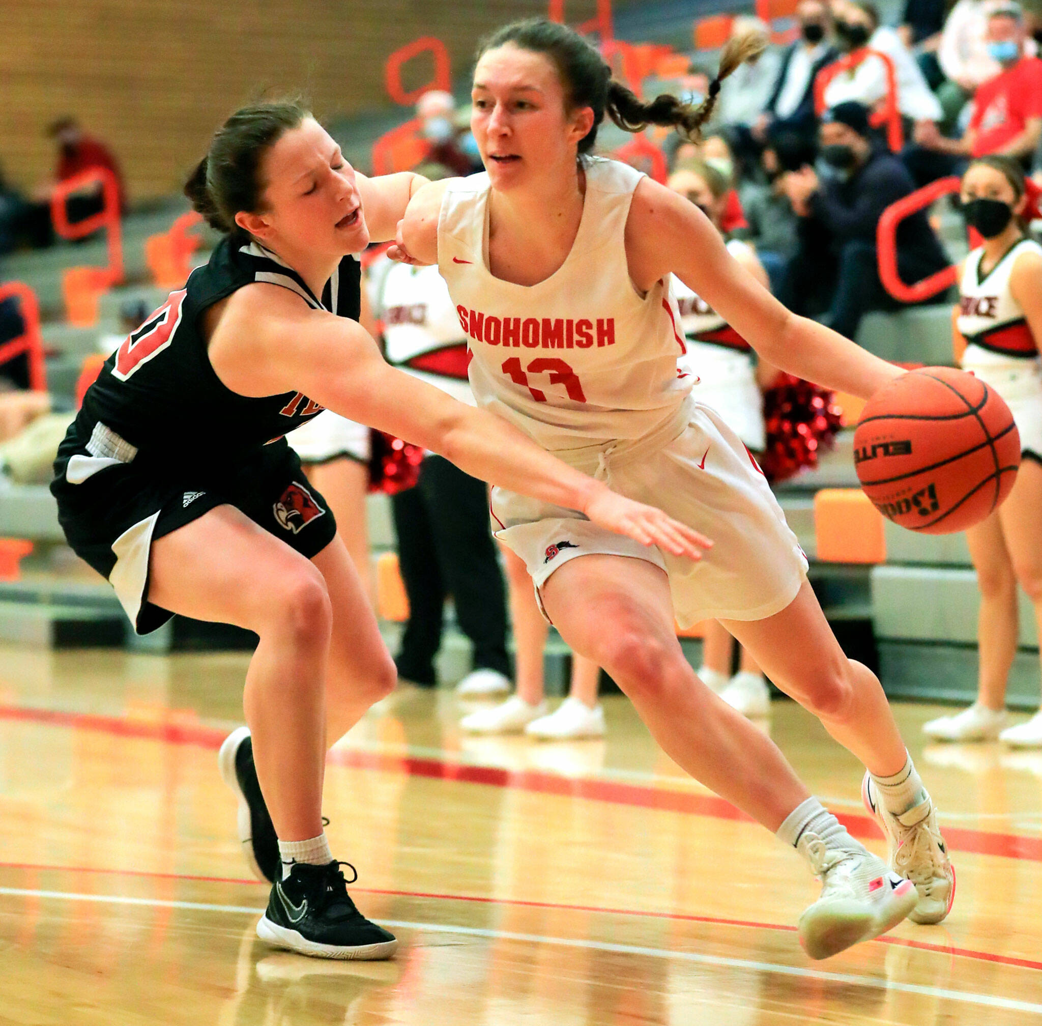 Ella Gallatin (right) and Snohomish are among the seven local girls basketball teams that have advanced to this weekend’s state regional round. (Kevin Clark / The Herald )