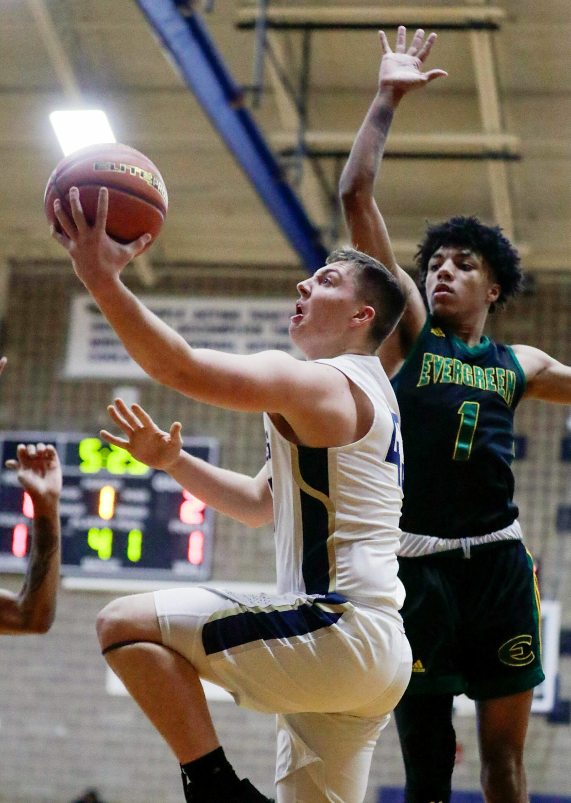 Ethan Martin scored 35 points, including 26 in the first half, to lead Arlington to a 73-53 win over Evergreen-Vancouver in a Class 3A state play-in game Tuesday night. (Kevin Clark / The Herald)