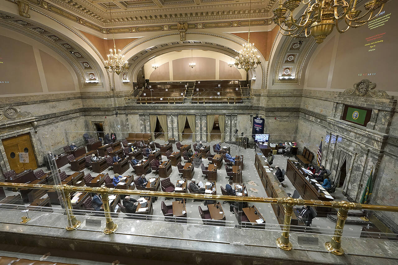 Legislators work on the Washington Senate floor at the Capitol in Olympia on Feb. 15. (AP Photo/Ted S. Warren)