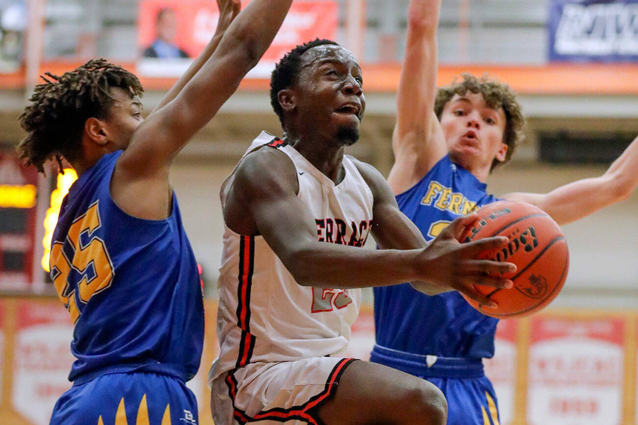 Mountlake Terrace's Jeffrey Anyimah splits Ferndale’s defense for a layup Saturday evening at during the 3A District Tournament at Everett Community College in Everett, Washington on February 19, 2022. (Kevin Clark / The Herald )