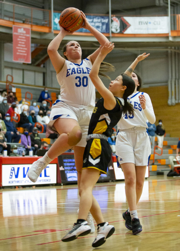 Grace Academy’s Kari Jones attempts a layup during the game against Cusick on Friday, Feb. 25, 2022 in Everett, Washington. (Olivia Vanni / The Herald)
