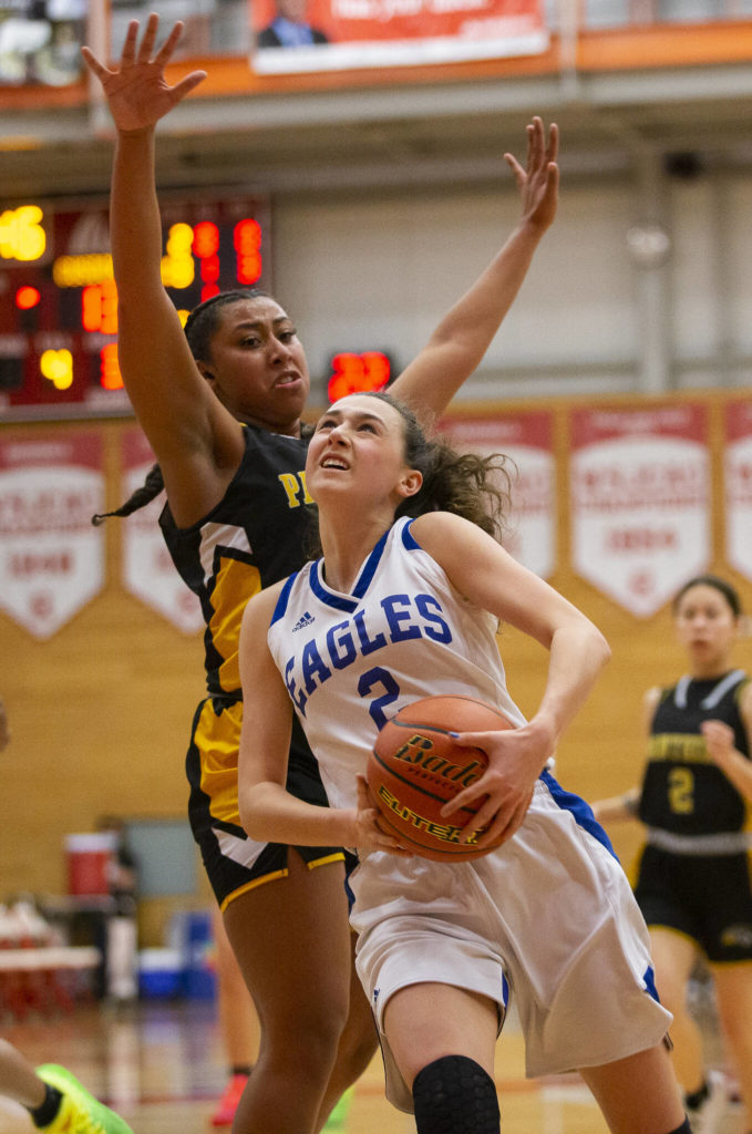 Grace Academy’s Zia Fackenthal drives tot eh hoop during the game against Cusick on Friday, Feb. 25, 2022 in Everett, Washington. (Olivia Vanni / The Herald)

