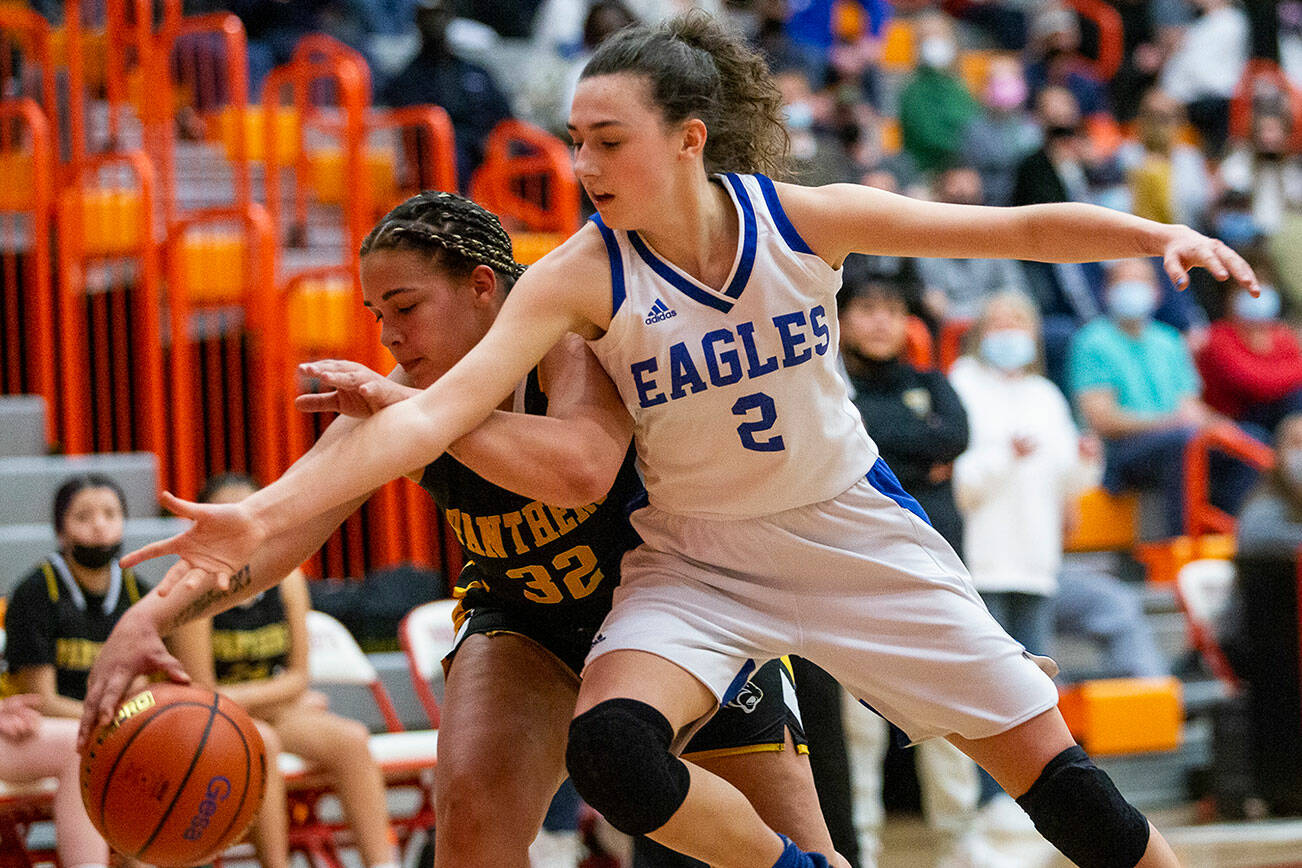 Grace Academy’s Zia Fackenthal tries to steal the ball from Cusick’s Dalia Oliver during the game on Friday, Feb. 25, 2022 in Everett, Washington. (Olivia Vanni / The Herald)