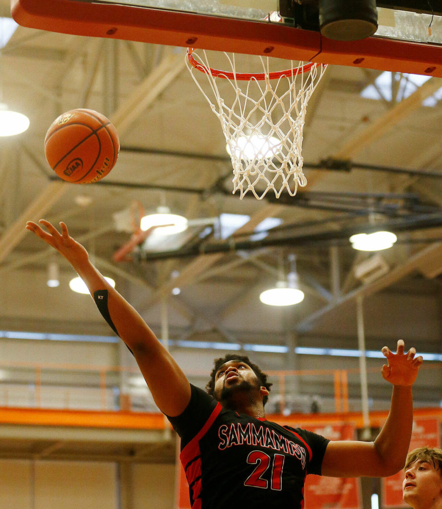 Sammamish’s Jaydon Adams grabs a defensive rebound against Lakewood Saturday, Feb. 26, 2022, during a Class 2A regional matchup at Everett Community College in Everett, Washington. (Ryan Berry / The Herald)
