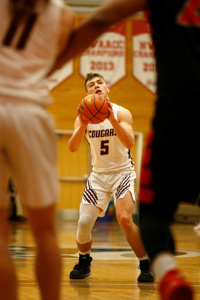 Lakewood’s Justice Taylor prepares to hit a three against Sammamish Saturday, Feb. 26, 2022, during a Class 2A regional matchup at Everett Community College in Everett, Washington. (Ryan Berry / The Herald)
