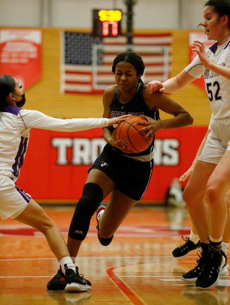 Eastlake’s Kaylia Jackson drives to the basket against Lake Stevens Saturday, Feb. 26, 2022, during a Class 4A regional matchup at Everett Community College in Everett, Washington. (Ryan Berry / The Herald)
