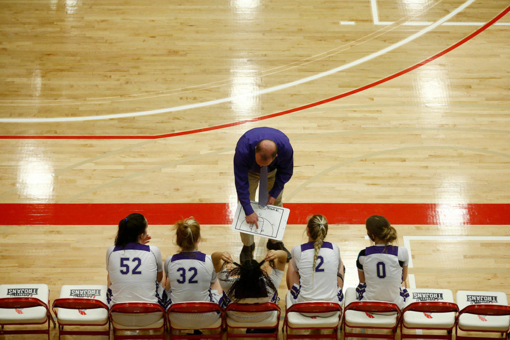 Lake Stevens head coach Randy Edens talks to his starters before a game against Eastlake Saturday, Feb. 26, 2022, in a Class 4A regional matchup at Everett Community College in Everett, Washington. (Ryan Berry / The Herald)
