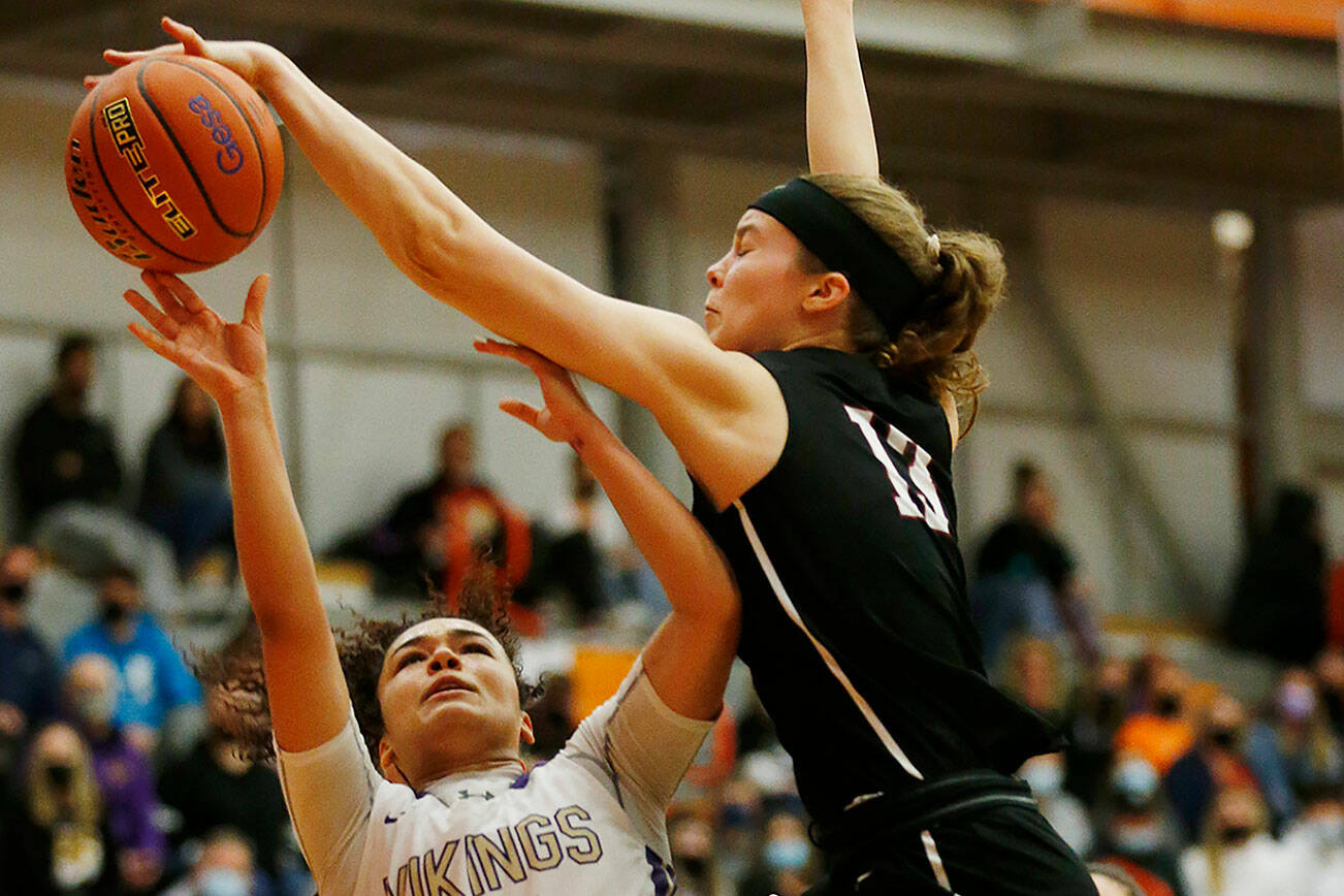 Eastlake’s Ava Schmidt records a block against Lake Stevens Saturday, Feb. 26, 2022, during a Class 4A regional matchup at Everett Community College in Everett, Washington. (Ryan Berry / The Herald)