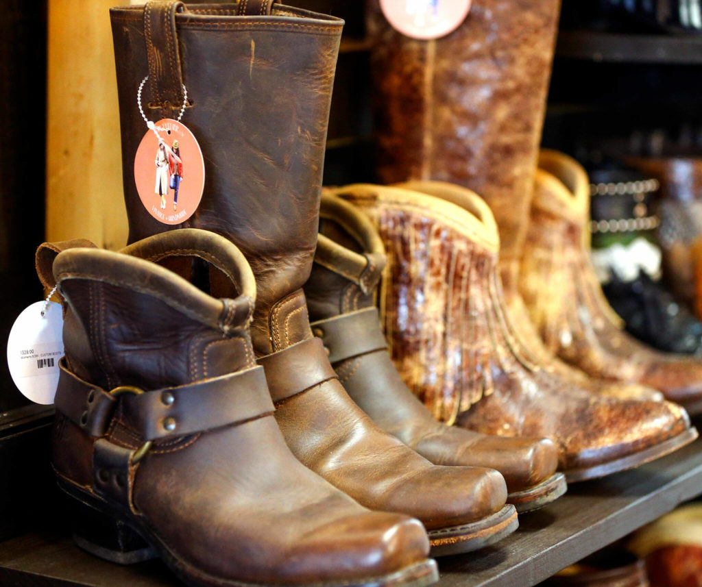 FauxyFurr in Arlington up-cycles boots, adding custom trim. (Kevin Clark / The Herald)
