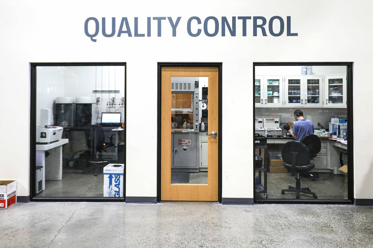 A quality control specialist at The Group14 Technologies in Woodinville, Washington on March 1, 2022.  (Kevin Clark / The Herald)