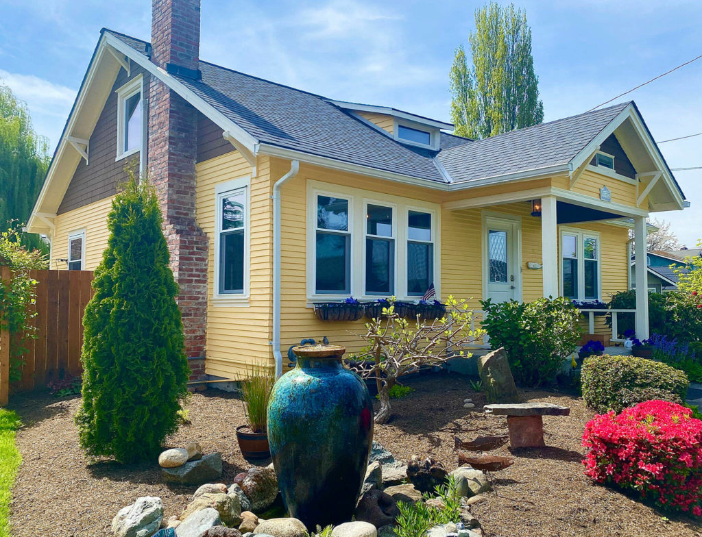 The 1924 two-bedroom Everett bungalow was painted a bright yellow that had seen better days. It was dubbed the “mellow yellow” house, a name that stuck even after it was painted gray. (Andrea Brown / The Herald)
