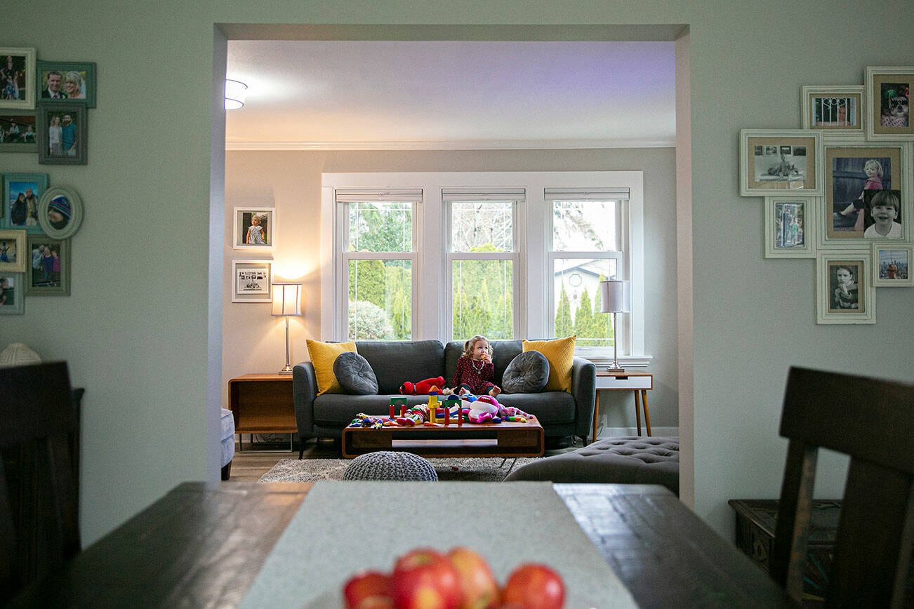 Aya Zebari, 2, the granddaughter of reporter Andrea Brown, plays in the living room of her grandparents’ recently renovated home Thursday, March 17, 2022, in Everett, Washington. (Ryan Berry / The Herald)