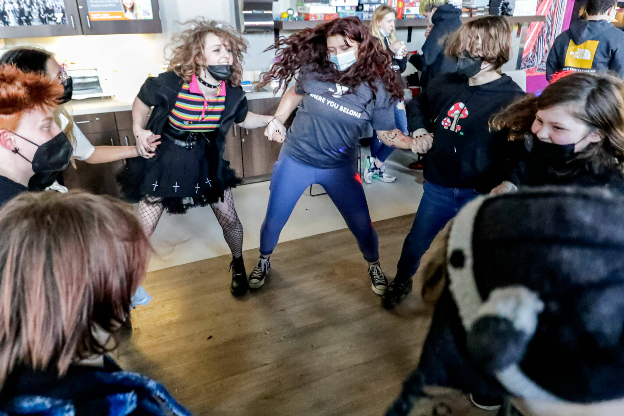 Members of PRISM close out a dance-off Friday at the Stanwood-Camano YMCA in Stanwood. (Kevin Clark / The Herald)