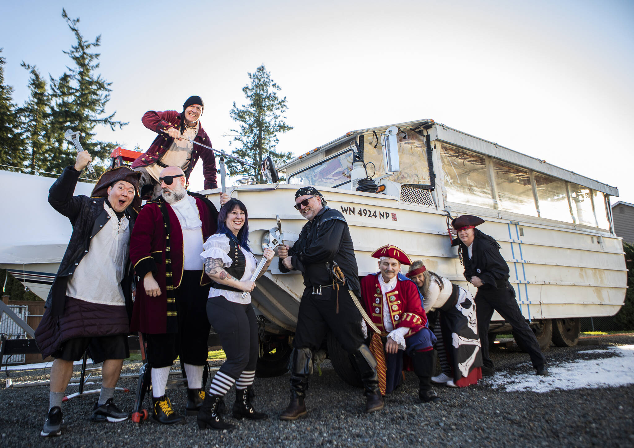 The Mukfest Pirates outside their 1945 “DUKW” vehicle — soon-to-be pirate ship — in Mukilteo. (Olivia Vanni / The Herald)