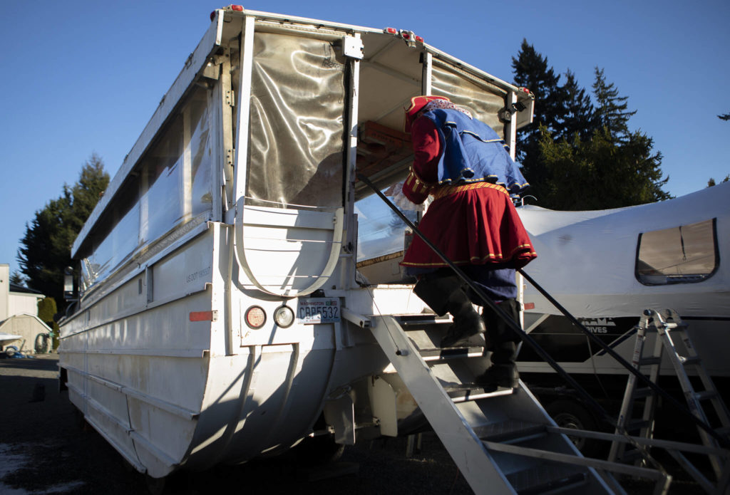 George Safadago, also known as Captain Shipwreck, boards the 1945 “DUKW” in Mukilteo. (Olivia Vanni / The Herald)
