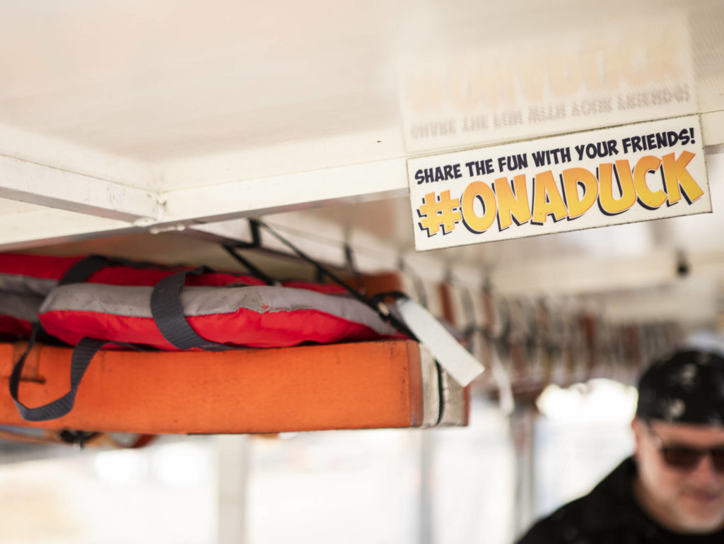 Signs from the Duck tours visible inside the vehicle in Mukilteo. (Olivia Vanni / The Herald)
