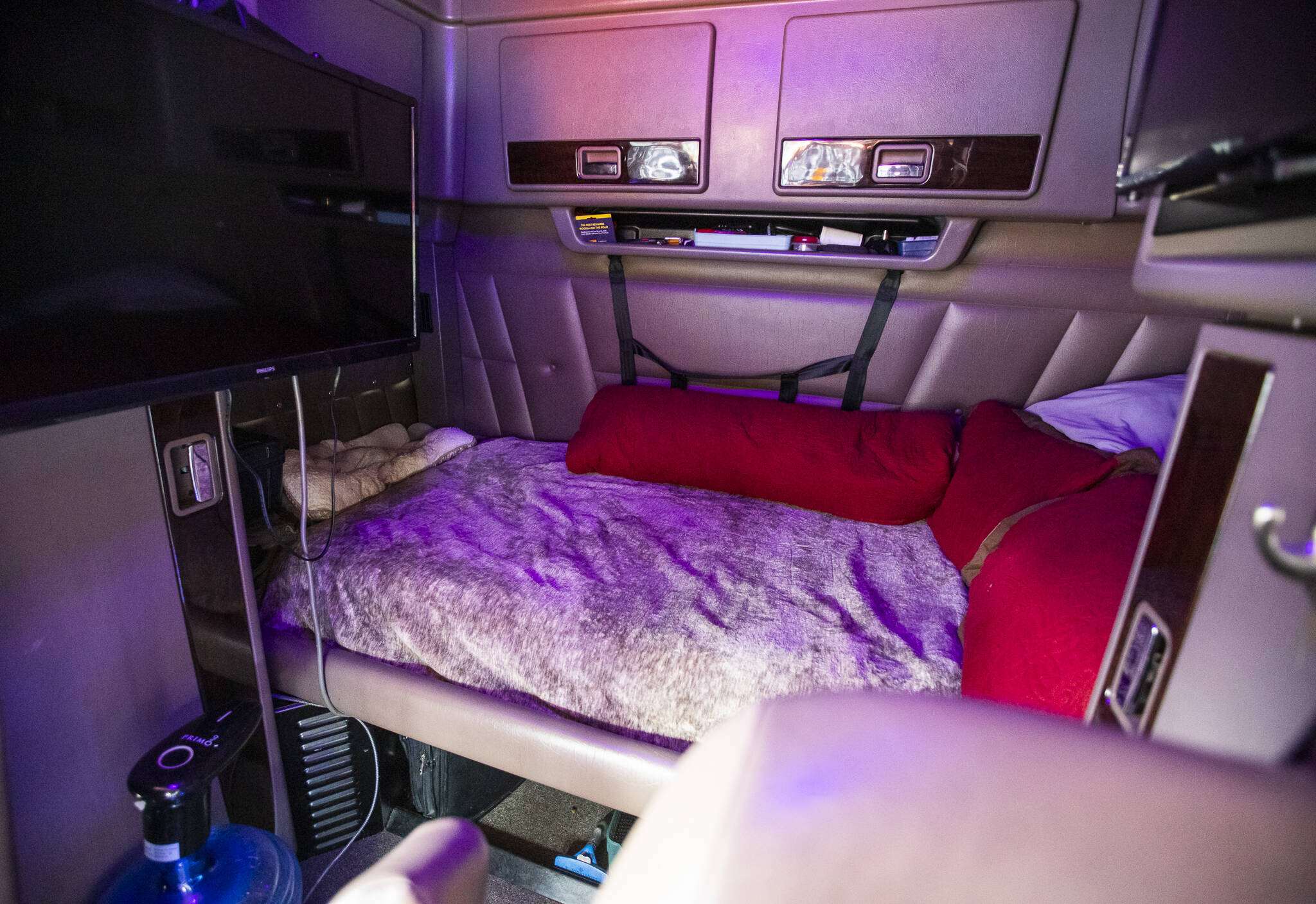 The sleeping quarters of Dirksen’s truck includes a television and a small refrigerator. (Olivia Vanni / The Herald)
